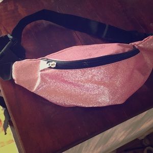 A pink bedazzled fanny pack